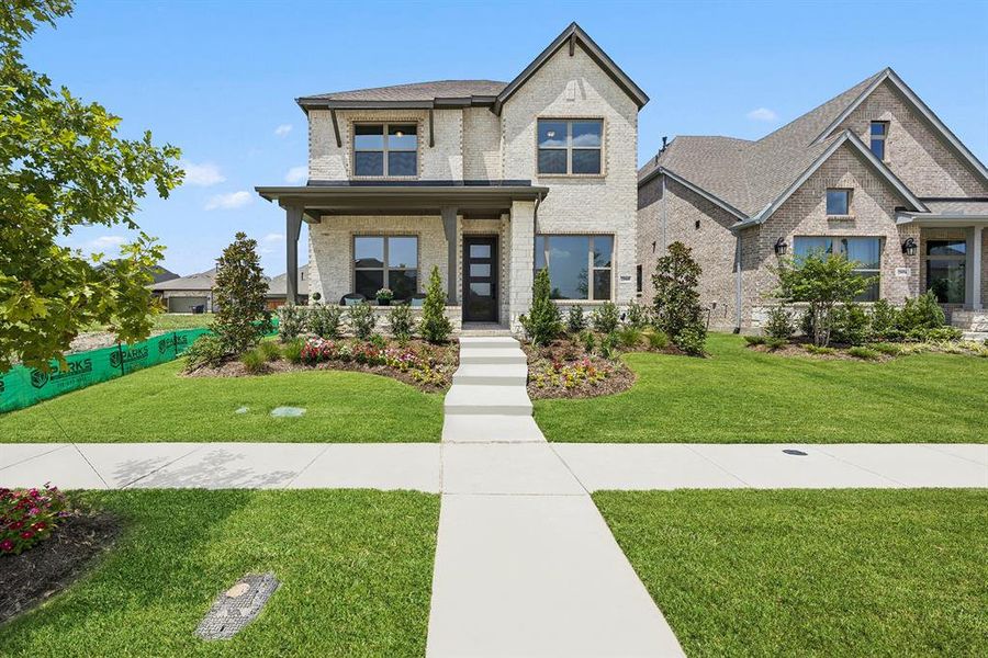 Front exterior of a new home in Mantua Point Gardens, Van Alstyne, TX, highlighting curb appeal (Image 1). Front exterior of a new home in Mantua Point Gardens, Van Alstyne, TX, highlighting curb appeal (Image 1).