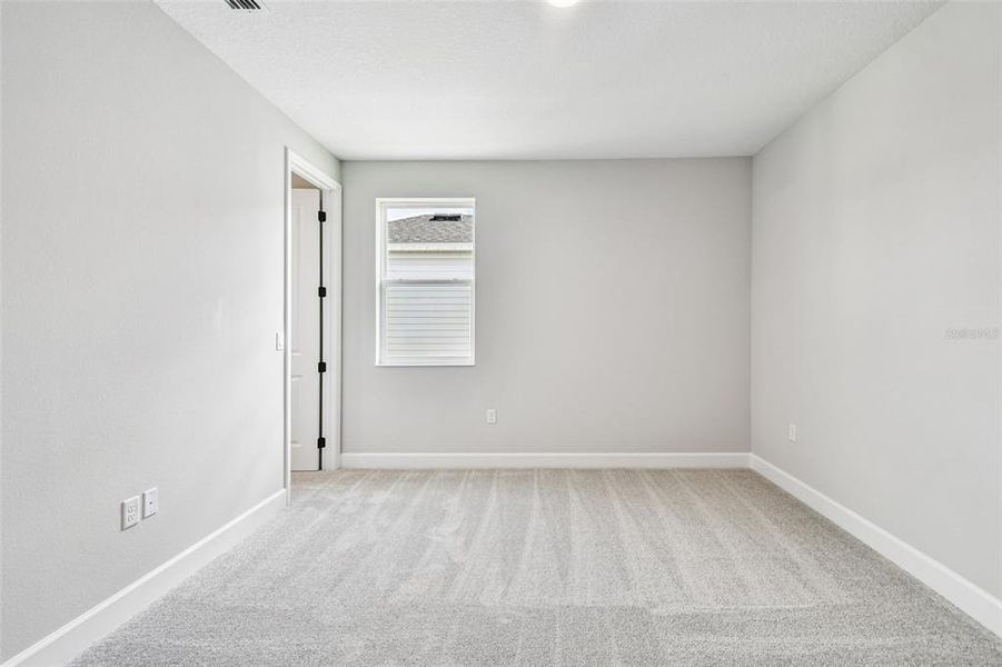 Spacious, unfurnished interior of a new home in Solace at Corner Lake, Orlando (Image 49).