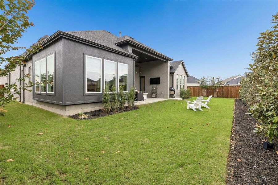 Exterior details and patio area of a home in Windsong Ranch 71' Series, Prosper (Image 21).