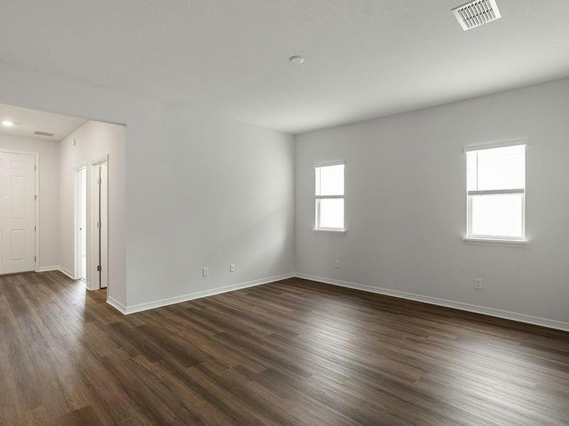 A living room provides additional flexible-use living space.