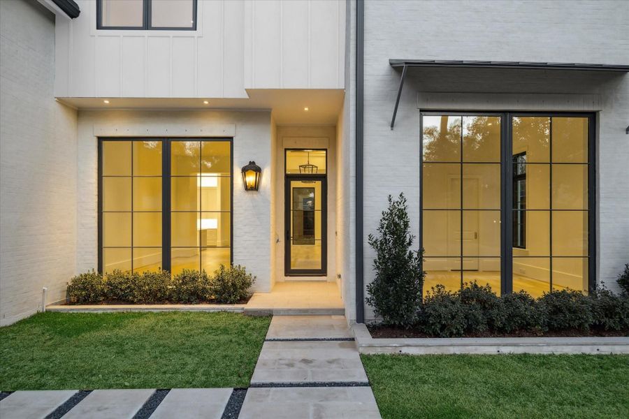 [Front Entrance]A deep portico entrance opens into the foyer. Note aluminum clad front door.