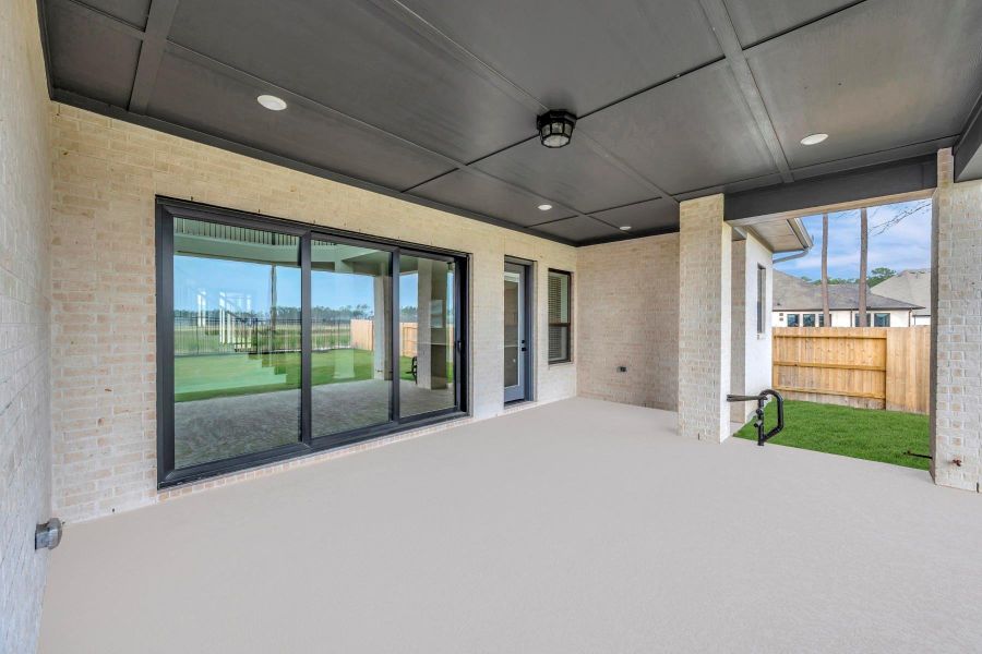 Exterior details and patio area of a home in ARTAVIA 65' Homesites, Conroe (Image 4).
