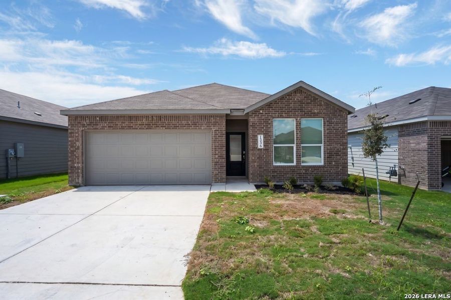 Front exterior of a new home in Sky Ranch, New Braunfels, TX, highlighting curb appeal (Image 1). Front exterior of a new home in Sky Ranch, New Braunfels, TX, highlighting curb appeal (Image 1).