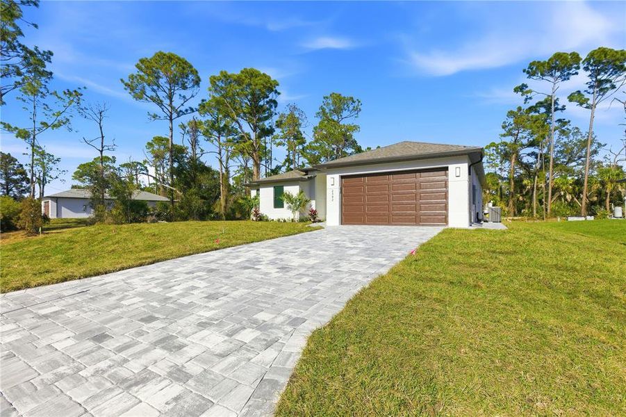 Front exterior of a new home in , North Port, FL, highlighting curb appeal (Image 20).