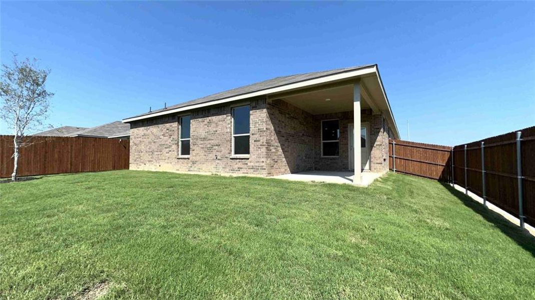 Rear Elevation and covered back Patio - All Home and community information, including pricing, included features, terms, availability and amenities, are subject to change at any time without notice or obligation. All Drawings, pictures, photographs, video, square footages, floor plans, elevations, features, colors and sizes are approximate for illustration purposes only and will vary from the homes as built.