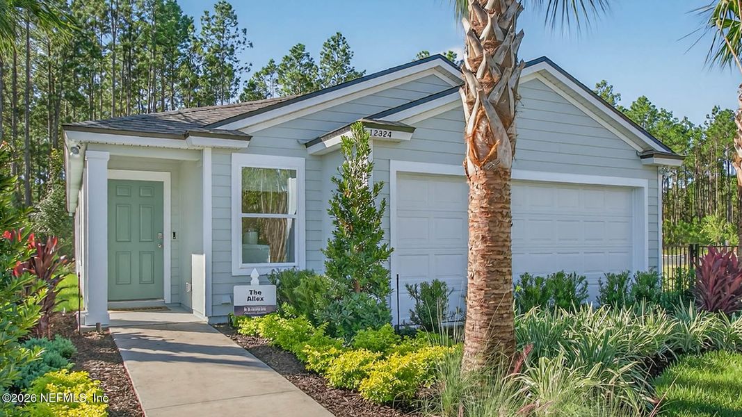 Front exterior of a new home in Copes Landing, Jacksonville, FL, highlighting curb appeal (Image 23).