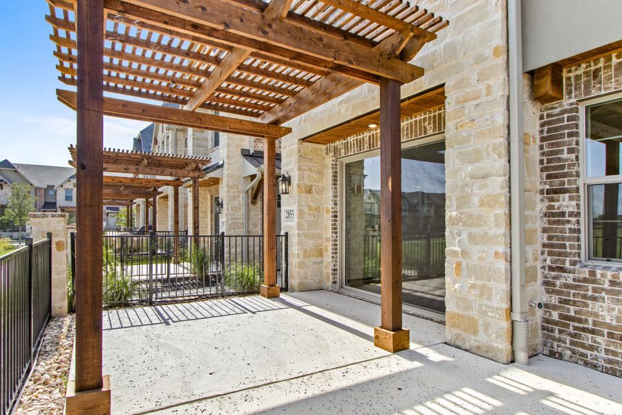 Exterior details and patio area of a home in The Tribute, The Colony (Image 4). Exterior details and patio area of a home in The Tribute, The Colony (Image 4).