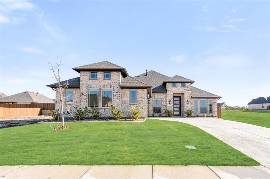 Front exterior of a new home in Parks at Panchasarp Farms, Burleson, TX, highlighting curb appeal (Image 2).