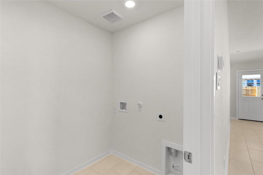 Laundry room featuring hookup for a gas dryer, hookup for an electric dryer, light tile patterned floors, hookup for a washing machine, and recessed lighting