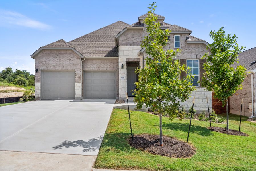 Representative exterior photo of a completed home built from the Waterville by Ashton Woods in The Trails at Carmel, Pflugerville, TX (Image 30).