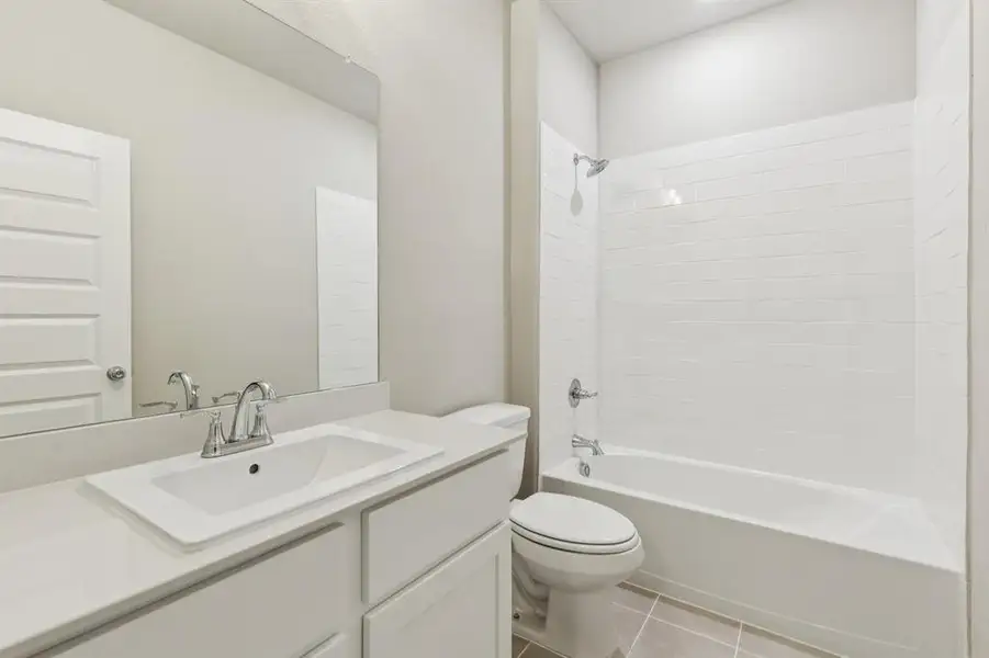 Bathroom in the Stanley II home plan by Trophy Signature Homes – REPRESENTATIVE PHOTO