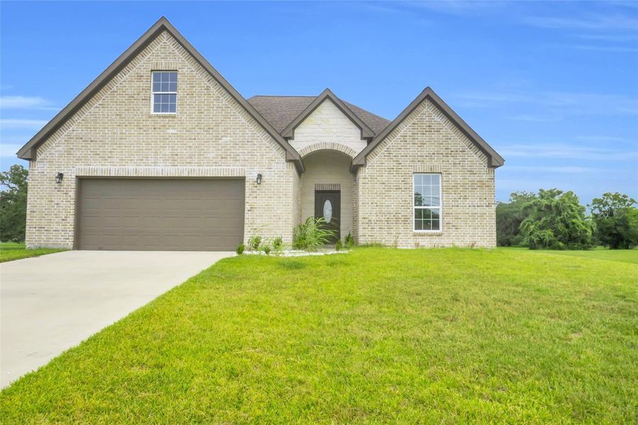 Front exterior of a new home in , Angleton, TX, highlighting curb appeal (Image 10). Front exterior of a new home in , Angleton, TX, highlighting curb appeal (Image 10).