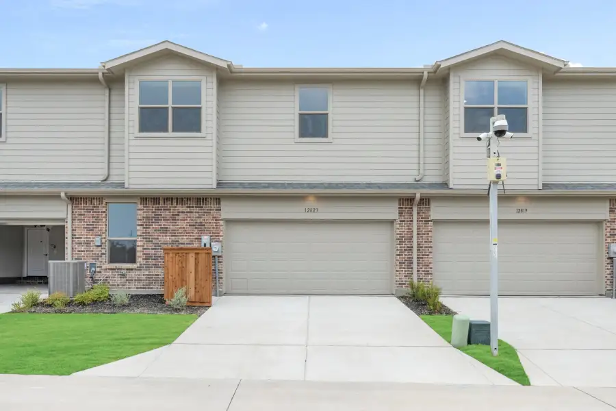 Front exterior of a new home in Cottonwood Creek, Rowlett, TX, highlighting curb appeal (Image 30).