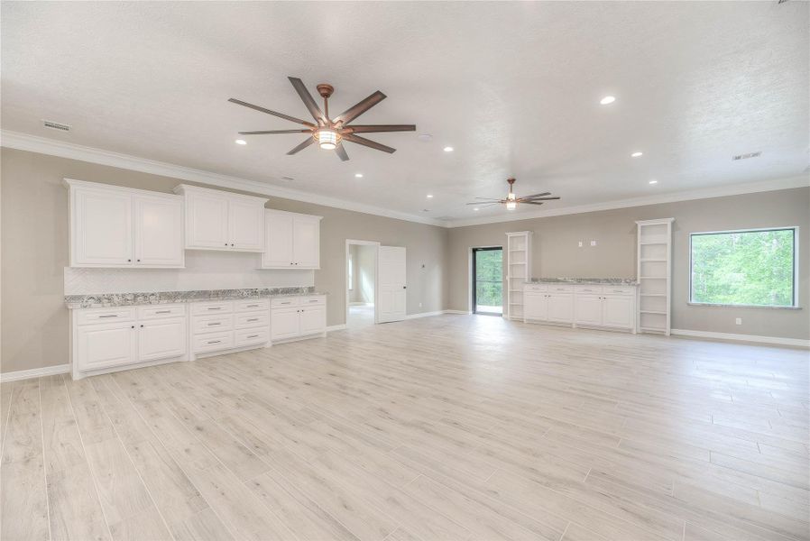Living room with plenty of cabinet space and room for furniture with great lighting Living room with plenty of cabinet space and room for furniture with great lighting