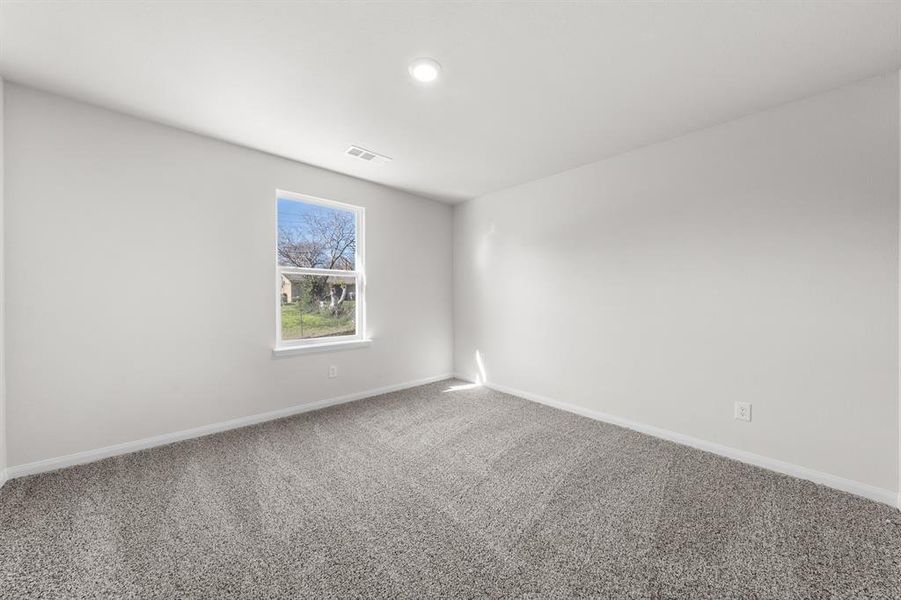 Spare room with carpet flooring