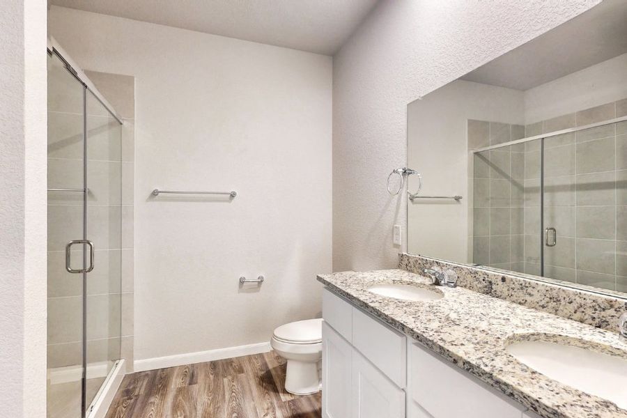 A bathroom with a marble countertop. A bathroom with a marble countertop.