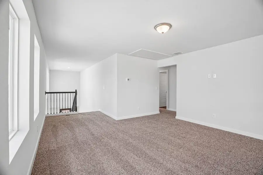 Spacious, unfurnished interior of a new home in The Meadows at Hunters Ranch, San Antonio (Image 27).