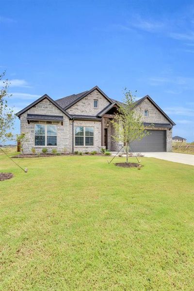 Front exterior of a new home in , Venus, TX, highlighting curb appeal (Image 2). Front exterior of a new home in , Venus, TX, highlighting curb appeal (Image 2).