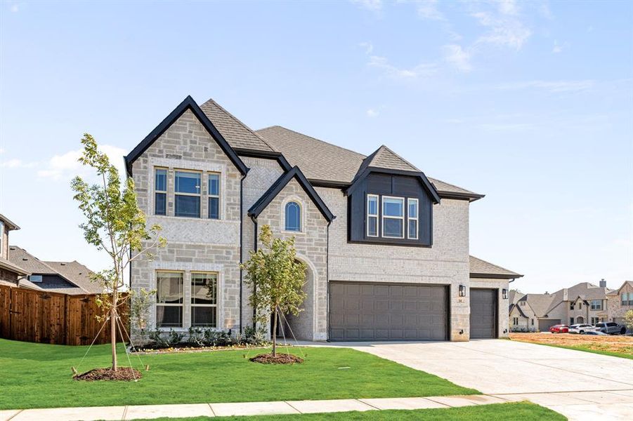 Front exterior of a new home in Mockingbird Hills 60-65, Joshua, TX, highlighting curb appeal (Image 2). Front exterior of a new home in Mockingbird Hills 60-65, Joshua, TX, highlighting curb appeal (Image 2).