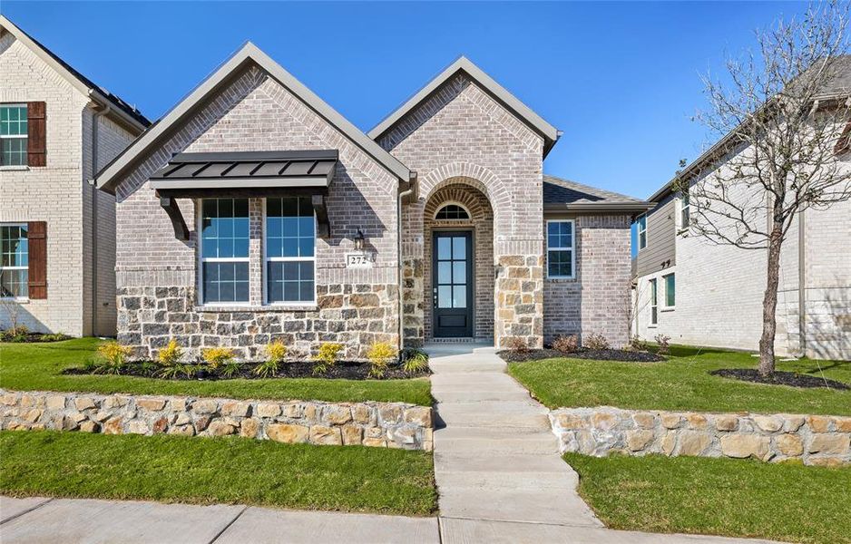 Front exterior of a new home in Edgewater, Fate, TX, highlighting curb appeal (Image 18).