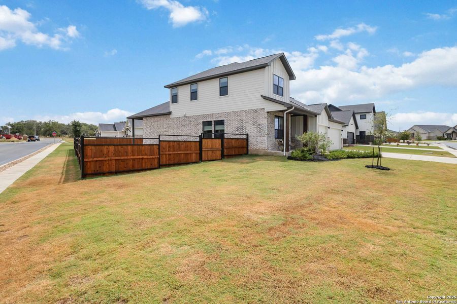 Front exterior of a new home in Woodbridge Farms, La Vernia, TX, highlighting curb appeal (Image 23).