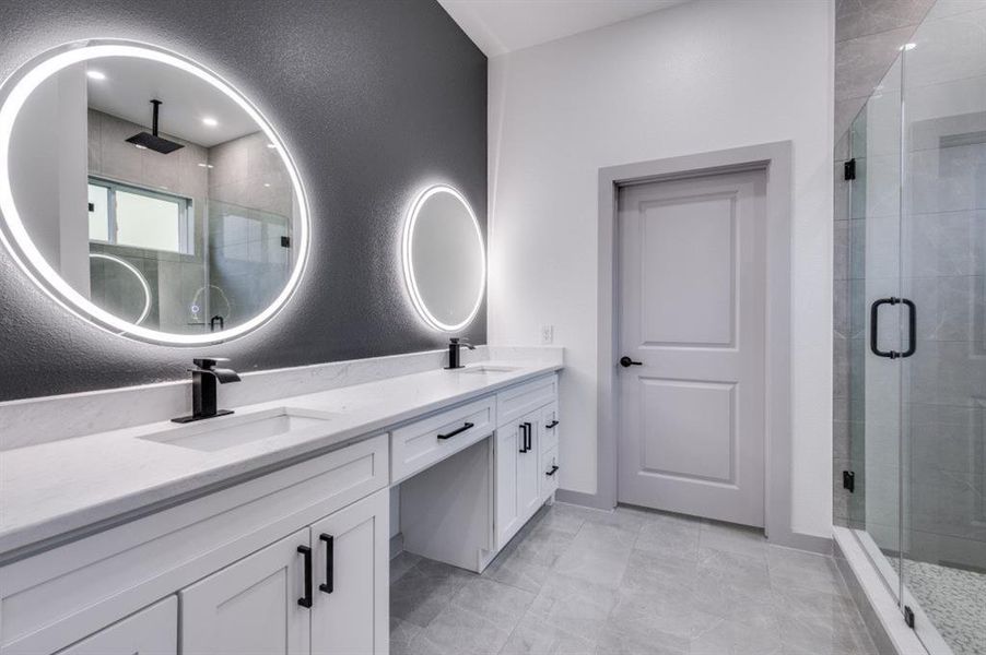 Bathroom with vanity and an enclosed shower