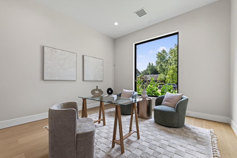 Private home office with oversized window and abundant natural light — ideal for remote work.