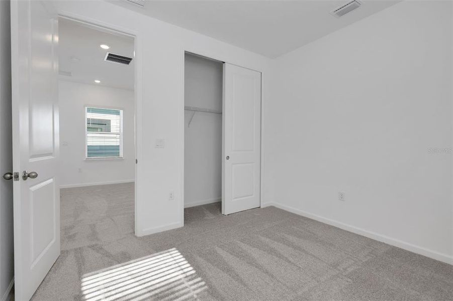 Spacious, unfurnished interior of a new home in Serenade at Ovation, Winter Garden (Image 19).