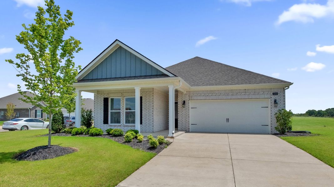 Front exterior of a new home in Riverwood Gardens, Oakland, TN, highlighting curb appeal (Image 1). Front exterior of a new home in Riverwood Gardens, Oakland, TN, highlighting curb appeal (Image 1).