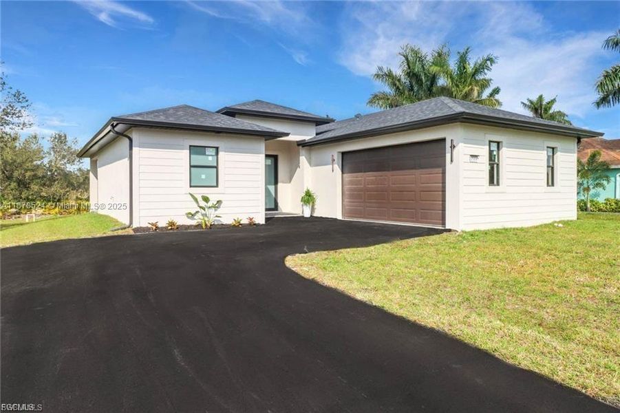Front exterior of a new home in , Lehigh Acres, FL, highlighting curb appeal (Image 2). Front exterior of a new home in , Lehigh Acres, FL, highlighting curb appeal (Image 2).