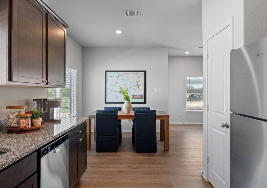 The dining room sits right off of the kitchen. The dining room sits right off of the kitchen.