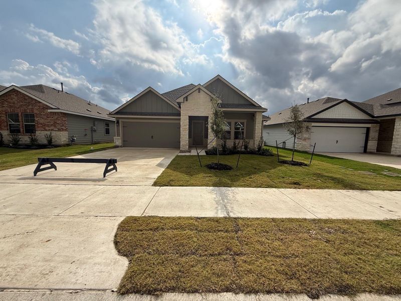 Front exterior of a new home in Southern Pointe, College Station, TX, highlighting curb appeal (Image 1).