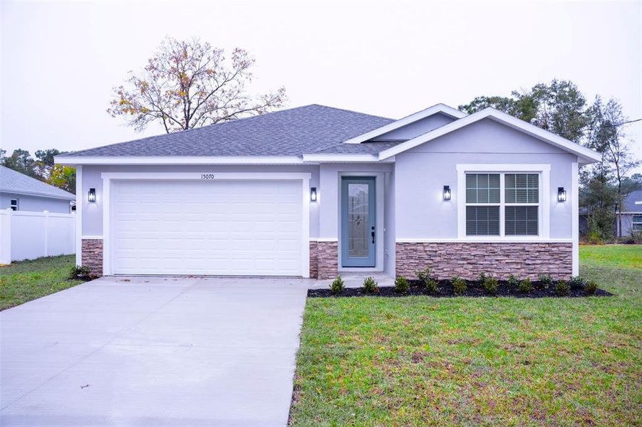 Front exterior of a new home in , Summerfield, FL, highlighting curb appeal (Image 1). Front exterior of a new home in , Summerfield, FL, highlighting curb appeal (Image 1).