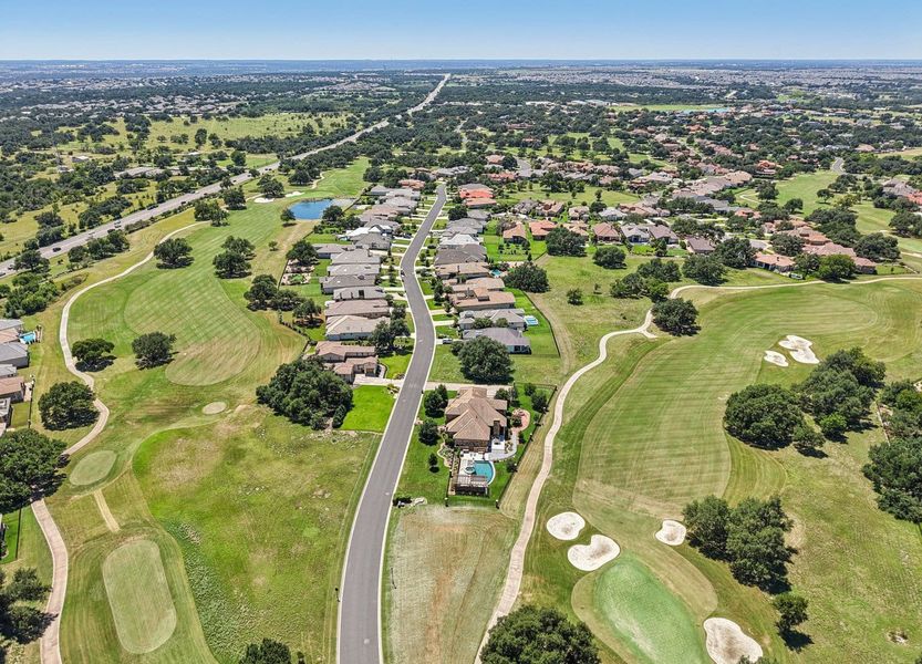 Front exterior of a new home in Cimarron Hills – Villas & Country Club, Georgetown, TX, highlighting curb appeal (Image 25).