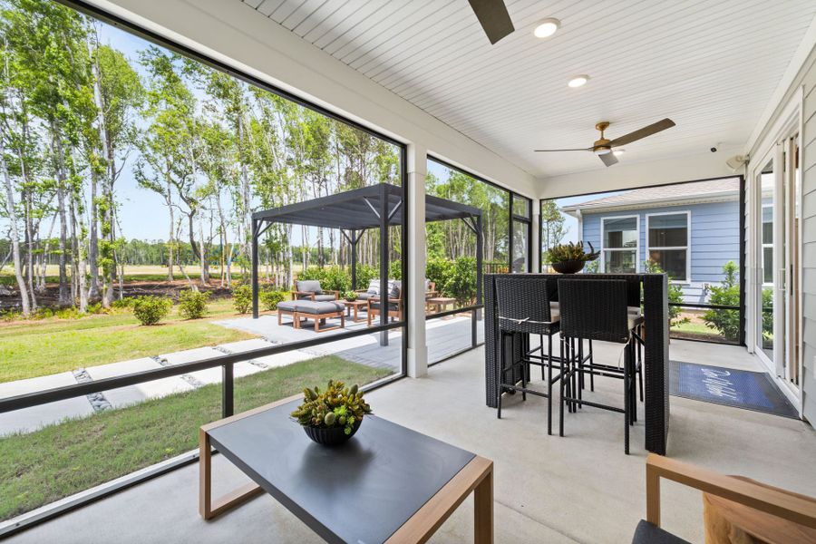 Exterior details and patio area of a home in Sun City Hilton Head, Bluffton (Image 3).