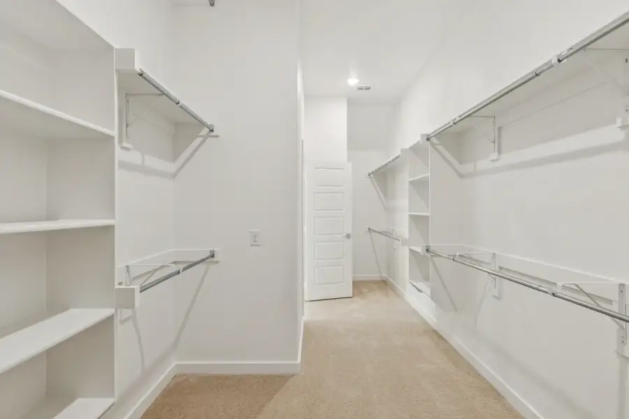 Primary Closet in the Da Vinci II home plan by Trophy Signature Homes – REPRESENTATIVE PHOTO