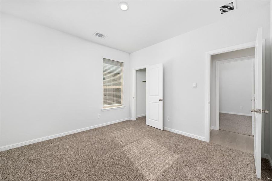 Unfurnished bedroom featuring carpet floors