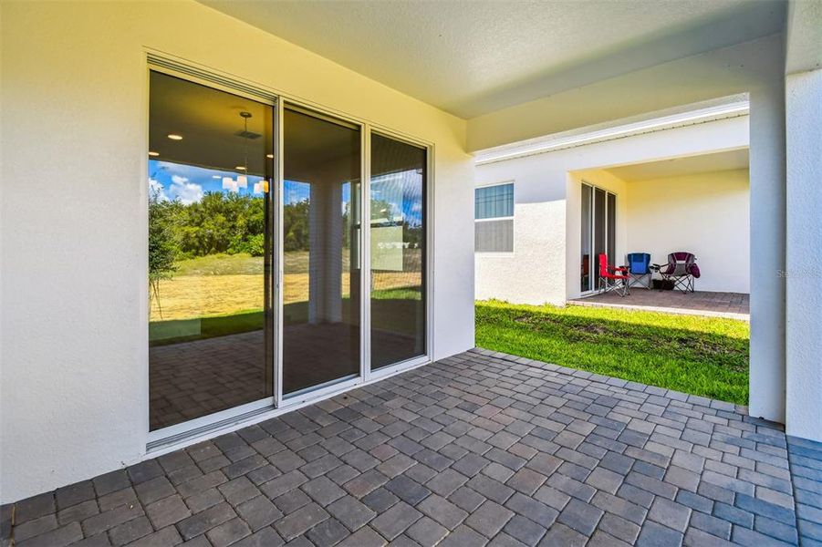 Exterior details and patio area of a home in Emerson Pointe, Apopka (Image 23).