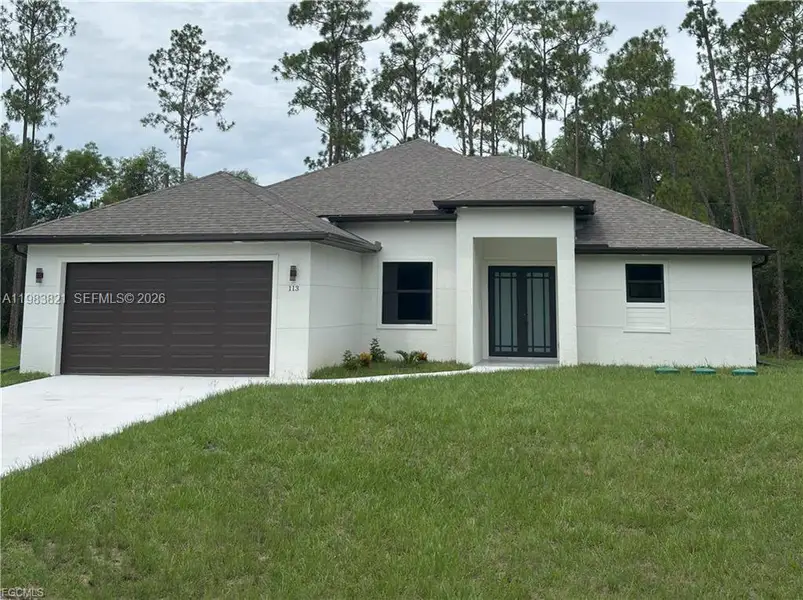 Front exterior of a new home in , Lehigh Acres, FL, highlighting curb appeal (Image 1). Front exterior of a new home in , Lehigh Acres, FL, highlighting curb appeal (Image 1).