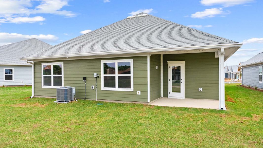 Exterior details and patio area of a home in Caballeros Estates At Hombre, Panama City Beach (Image 4).