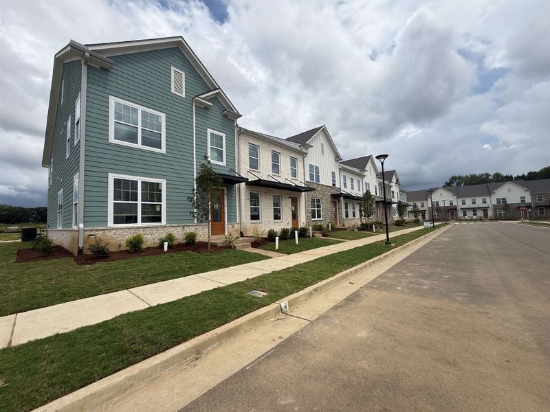 Two-story residence featuring light blue horizontal siding and a white trim Two-story residence featuring light blue horizontal siding and a white trim
