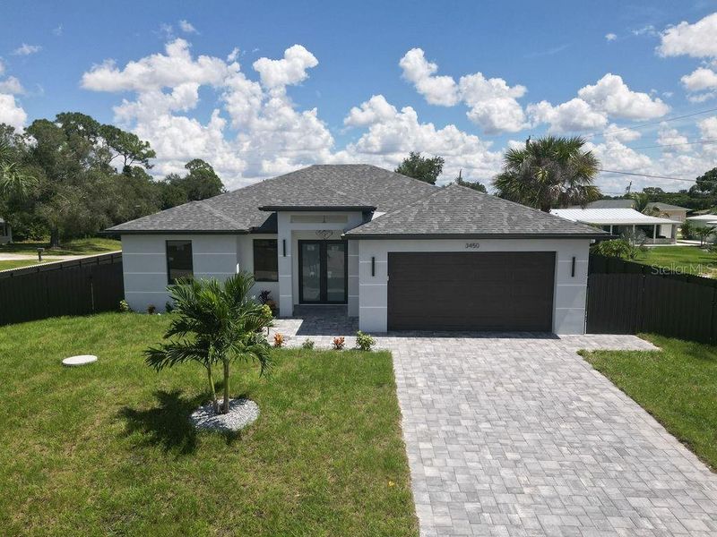 Front exterior of a new home in , Port Charlotte, FL, highlighting curb appeal (Image 23).
