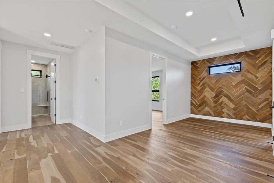 Upstairs Hallway with herringbone pattern wood accent wall. Upstairs Hallway with herringbone pattern wood accent wall.