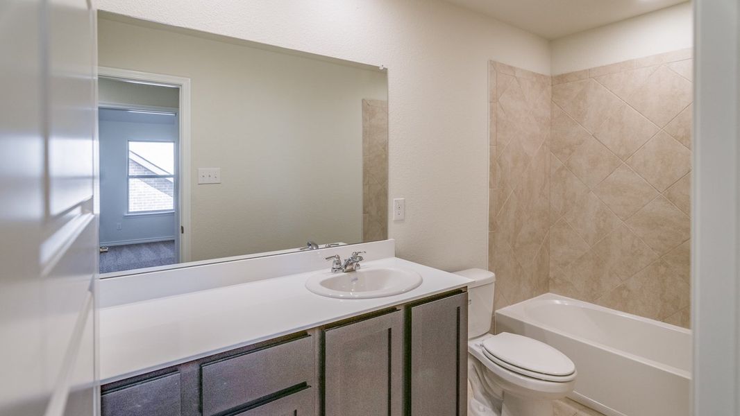 Representative furnished interior of a home built from the Daventry by D.R. Horton in Woodcreek, Fate (Image 5).