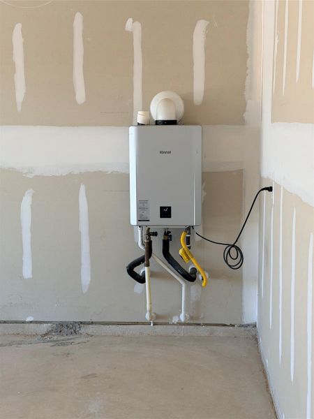 Utility room with water heater Utility room with water heater