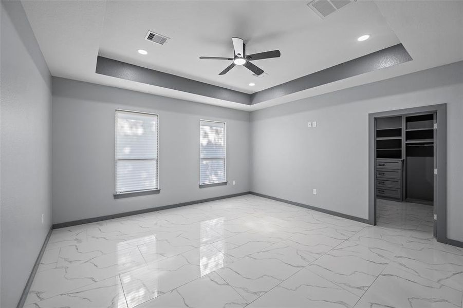 Primary Bedroom with beautiful tray ceilings.