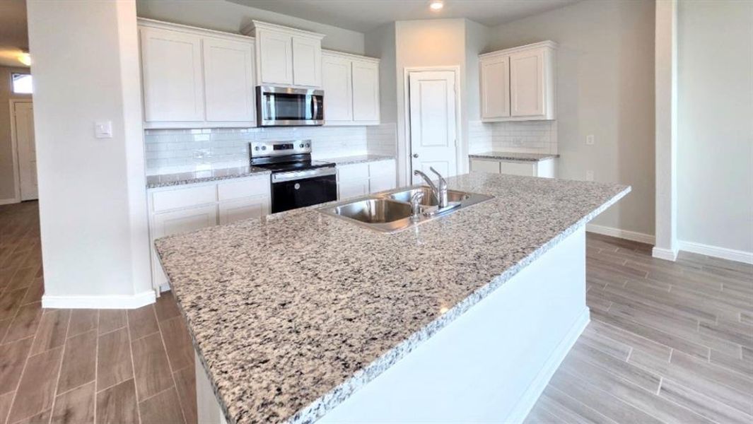 Kitchen - All Home and community information, including pricing, included features, terms, availability and amenities, are subject to change at any time without notice or obligation. All Drawings, pictures, photographs, video, square footages, floor plans, elevations, features, colors and sizes are approximate for illustration purposes only and will vary from the homes as built.