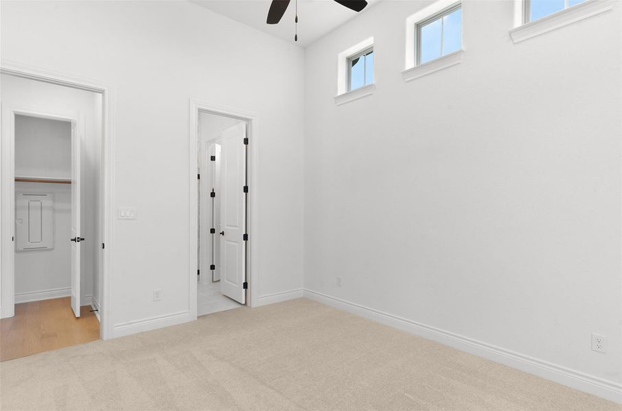 Sun-kissed walls and soaring ceilings provide a spacious feel in this well-appointed room.