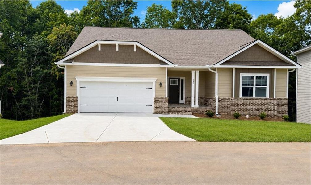 Front exterior of a new home in Habersham Meadows, Demorest, GA, highlighting curb appeal (Image 2). Front exterior of a new home in Habersham Meadows, Demorest, GA, highlighting curb appeal (Image 2).