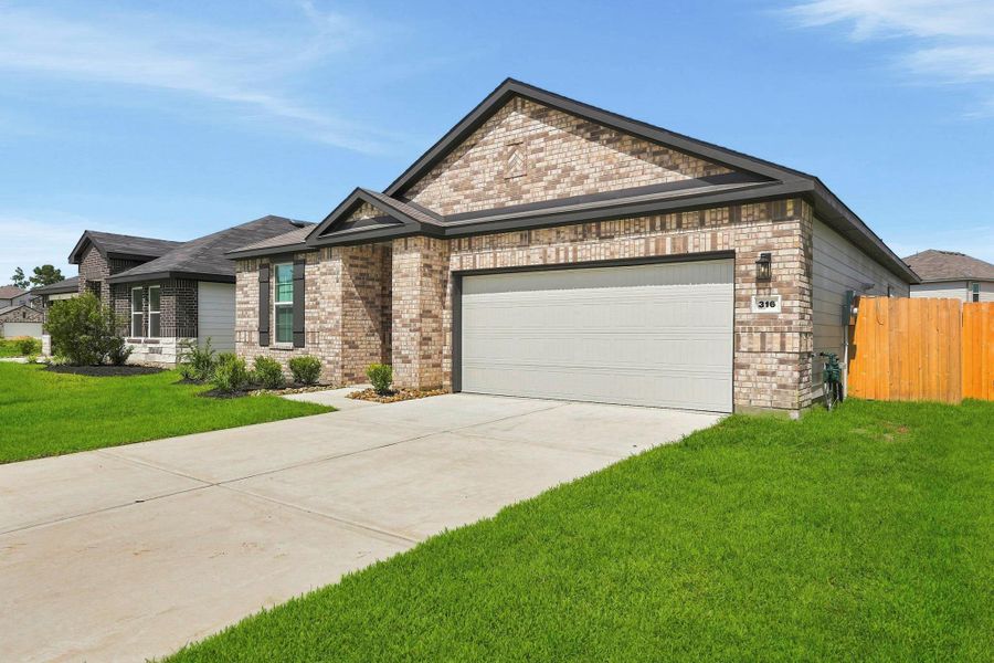 Front exterior of a new home in Maple Woods, Hockley, TX, highlighting curb appeal (Image 18).